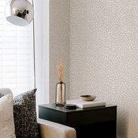 neutral living room interior with animal print wallpaper accent wall