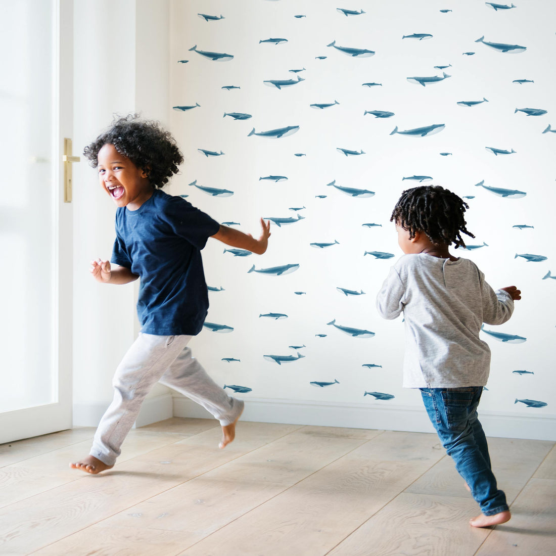 coastal style interior with blue whale print wallpaper