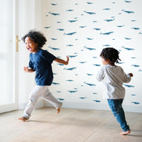 coastal style interior with blue whale print wallpaper