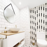 Boho chic powder room interior with brush stroke design wallpaper accent wall