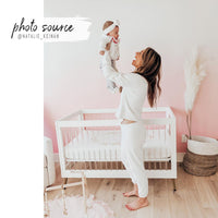 sweet girls nursery design with pink fade wallpaper design