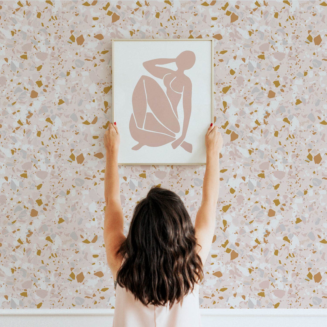 Pastel pink and gold terrazzo design removable wallpaper for powder room and nursery interiors