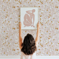 Pastel pink and gold terrazzo design removable wallpaper for powder room and nursery interiors