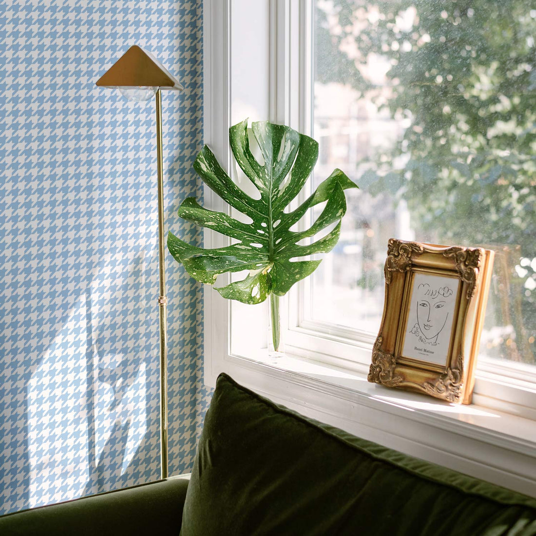 retro chic living room interior with blue houndstooth print wallpaper