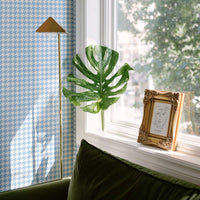 retro chic living room interior with blue houndstooth print wallpaper