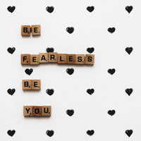 tiny little black and white hearts wallpaper for nursery interior