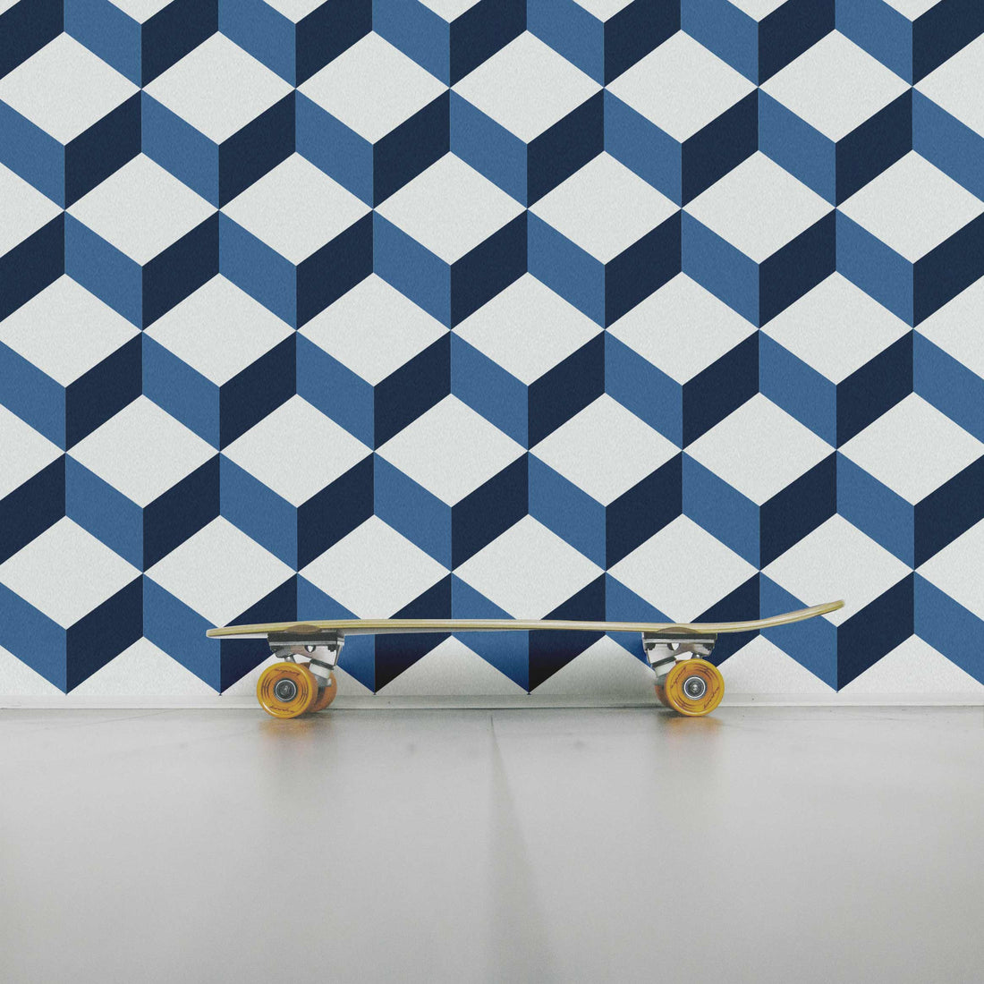 cube pattern wallpaper in navy blue for teen boys bedroom with skateboard