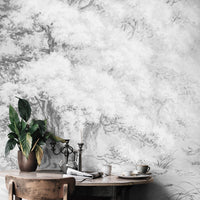 Soft grey vintage forest wall mural in bohemian living room interior
