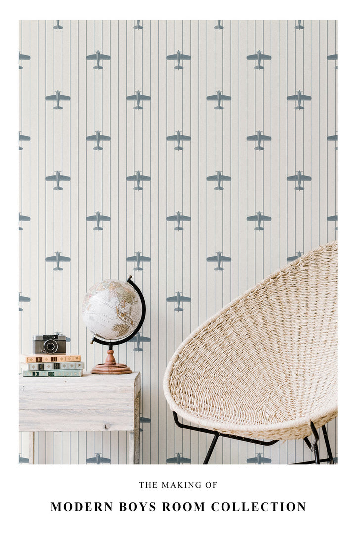 Airplane pattern wallpaper in boys room interior