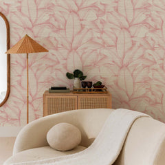 Pink grasscloth wallpaper with watercolor banana leaf pattern