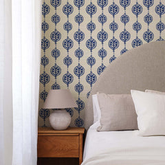 Navy blue grasscloth wallpaper with vintage floral pendant medallions