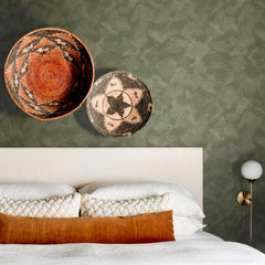 Olive green limewash bathroom wallpaper with organic painterly brushstroke texture in deep olive