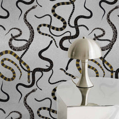 Silver metallic wallpaper with black and gold patterned snake print