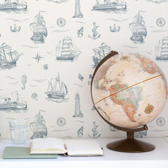 Cream nautical wallpaper with vintage blue-gray ship and anchor pattern