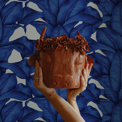 Bold blue banana leaf wallpaper with tropical botanical pattern