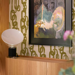 Chartreuse green silk wallpaper with a bold repeating chain link pattern