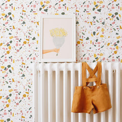 Multicolor terrazzo wallpaper with pink yellow and green fleck pattern