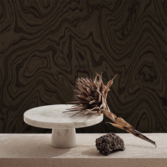 Dark brown accent wallpaper with wood grain swirl pattern
