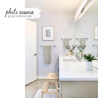 Modern farmhouse style kids bathroom interior with grey speckle wallpaper feature wall