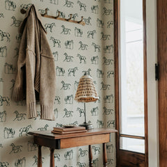 Cream wallpaper with rows of hand-drawn gray farm horse illustrations