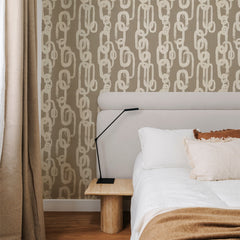 Beige hand-painted chain link wallpaper on a taupe background