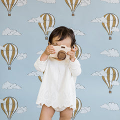 Light blue nursery wallpaper with hot air balloon and cloud pattern