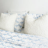 soft bed with vintage cotton fabric bedding