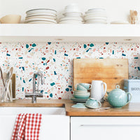 pastel colored stone terrazzo inspired white kitchen backsplash