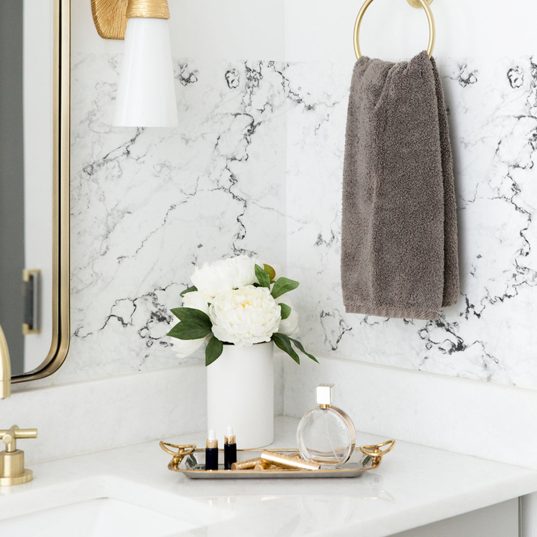 white marble design peel and stick backsplash in elegant bathroom