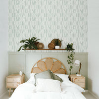 modern bohemian farmhouse style bedroom with green simple lines wallpaper