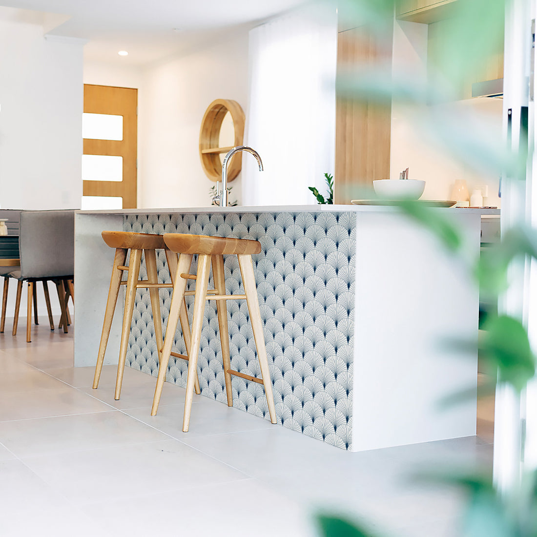 Modern white kitchen interior in beach house with removable wallpaper on kitchen island