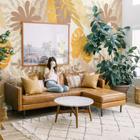 Bohemian jungle themed wall mural in boho style living room interior