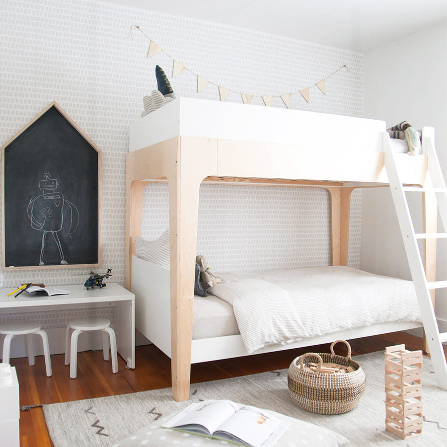 minimal bohemian style kids bedroom interior with neutral colored wallpaper