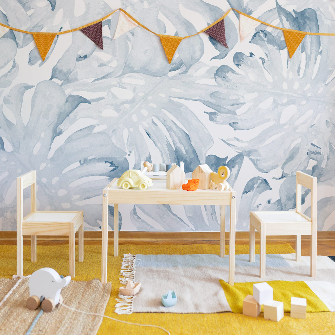 Coastal eclectic style kids playroom interior with oversized tropical wall mural