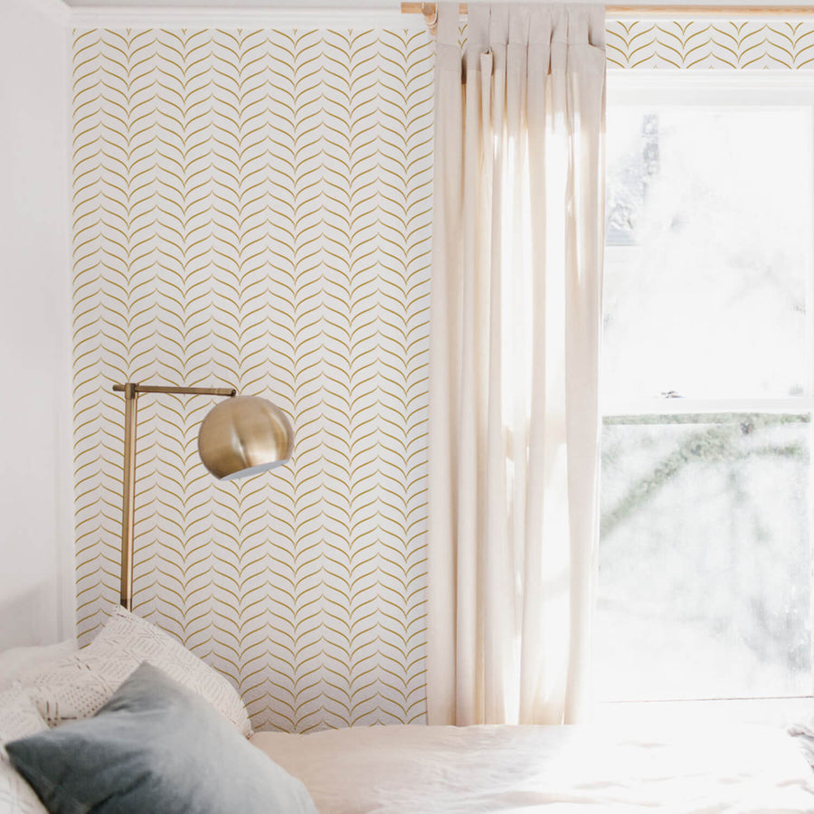 Modern chevron design removable wallpaper with faux gold color design in neutral bohemian bedroom interior