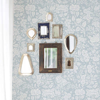 retro floral pattern wallpaper in light blue with mirrors