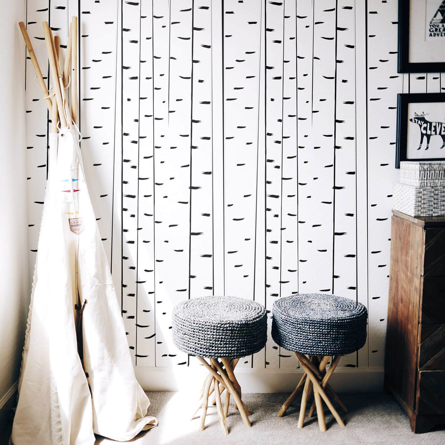Modern birch tree removable wallpaper in kid's playroom with teepee and woodland animal decor