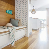 White beach house interior with blue color interior decor elements and light wood accent wall and modern herringbone design removable wallpaper