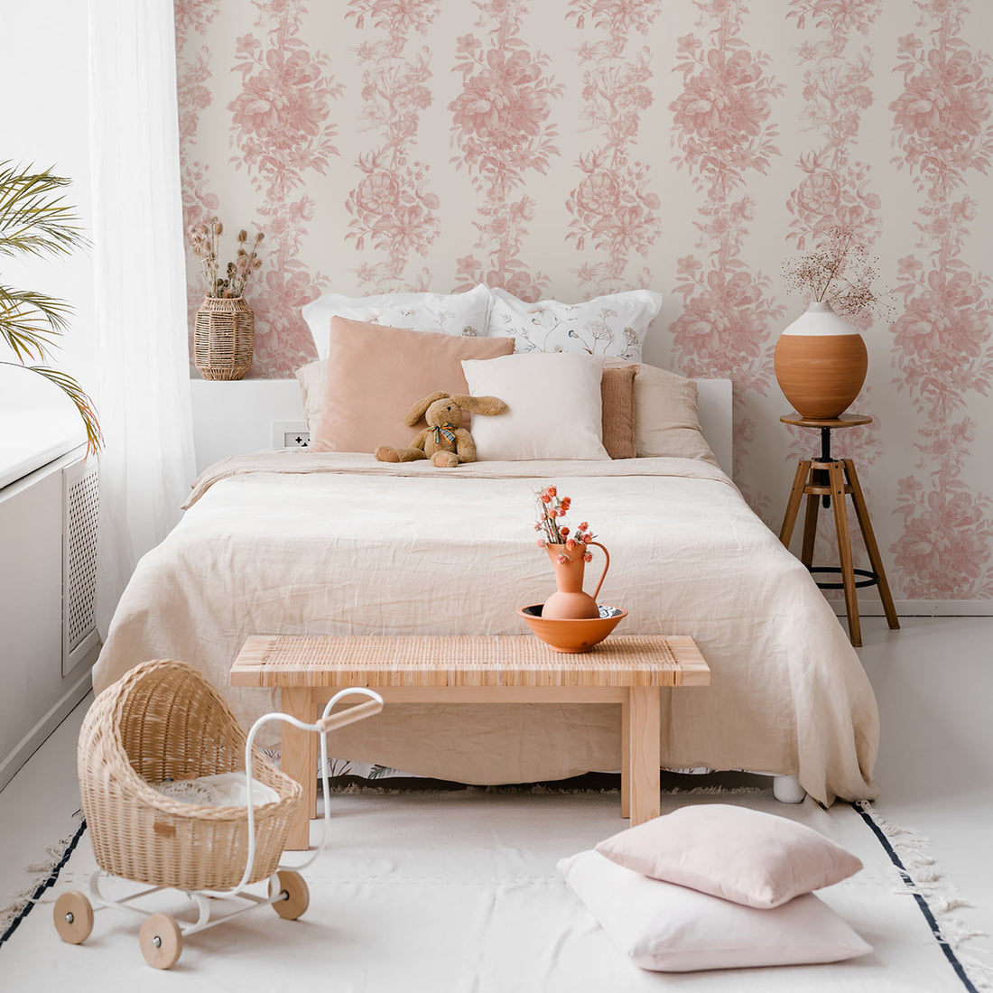 modern bohemian girls bedroom interior with light pink vintage florals inspired wallpaper