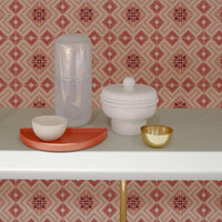 Pink moroccan tile wallpaper in modern boho kitchen interior shelf