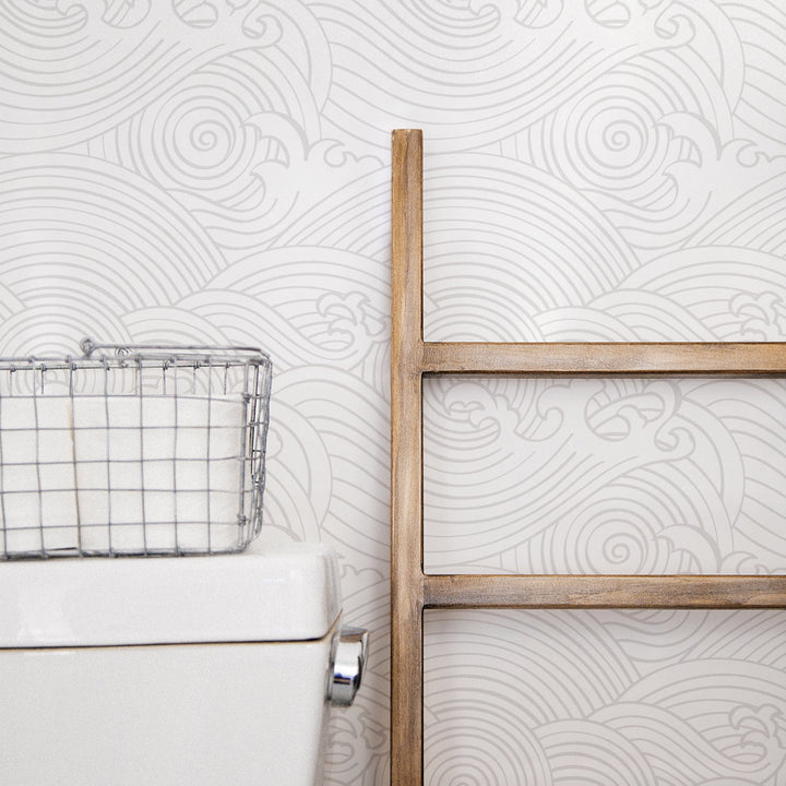 Coastal farmhouse style bathroom with wave design wallpaper