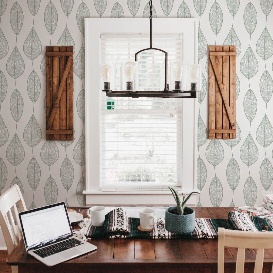 sage color botanical leaves removable wallpaper in farmhouse dining room interior