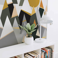 Modern mountains wall mural for scandinavian interior with reading nook, white bookcase and white table lamp