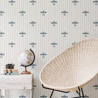 modern boys room interior with retro airplane pattern wallpaper in blue
