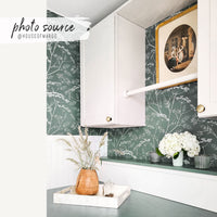 Modern farmhouse laundry room with green botanical removable wallpaper and vintage decor